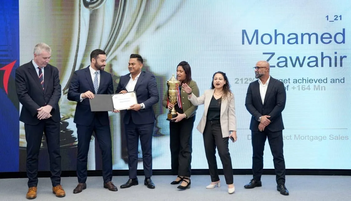 Zahrany on stage with FAB colleagues, 2024
